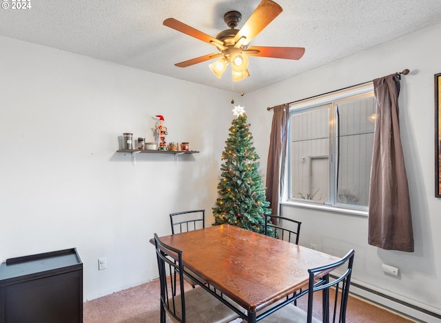 carpeted dining area with ceiling fan, a textured ceiling, and baseboard heating