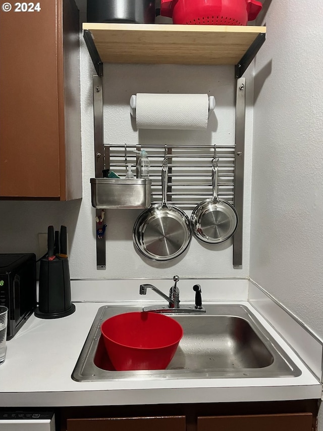 interior details with dishwashing machine and sink