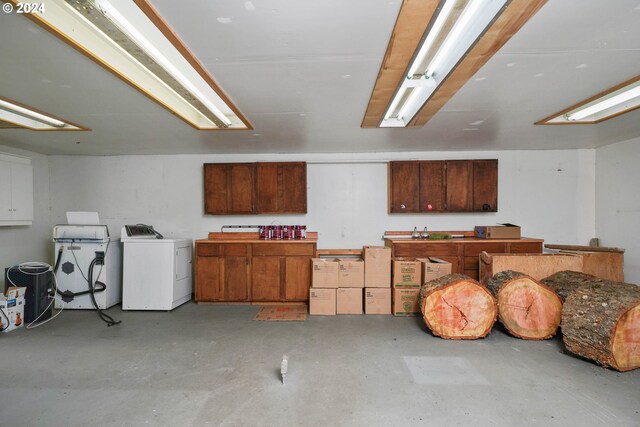 basement with washer / clothes dryer and a workshop area