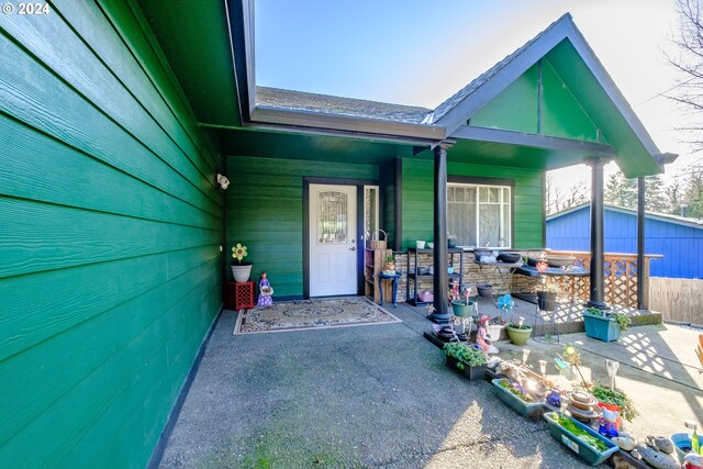 view of front of house with a patio area and a garage