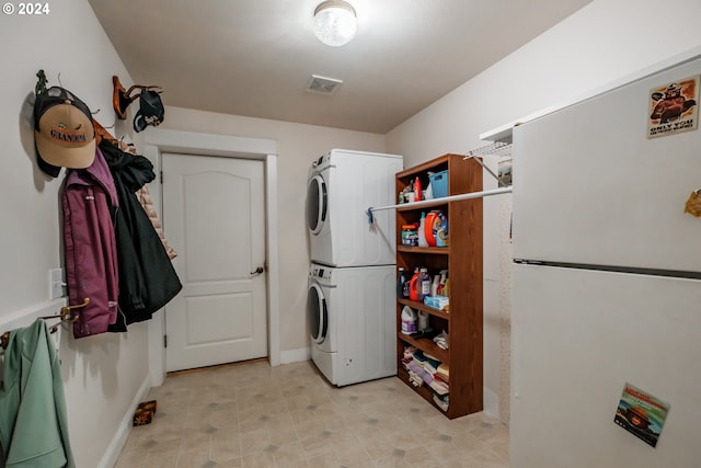 laundry area with stacked washer / dryer