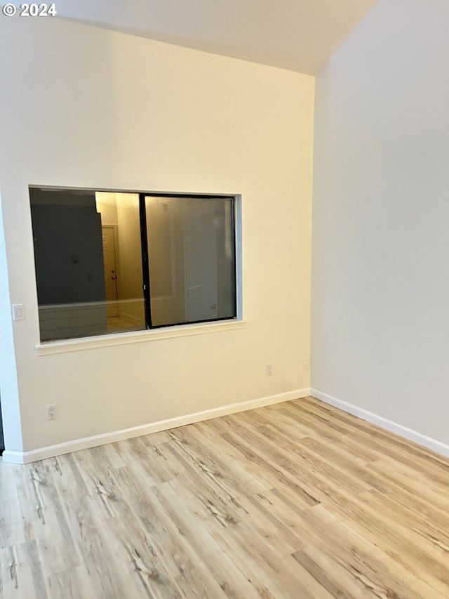 unfurnished room featuring light wood-type flooring