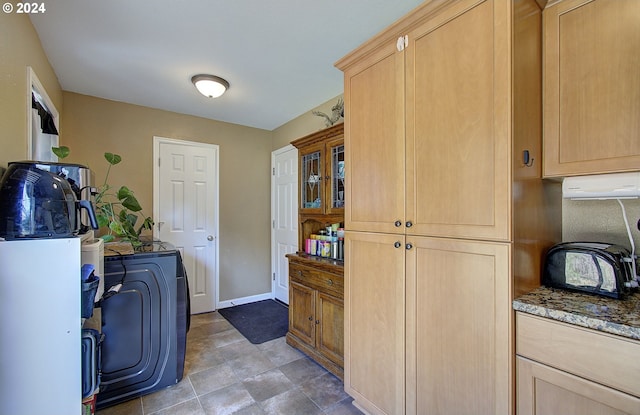 laundry area featuring cabinets and washing machine and dryer