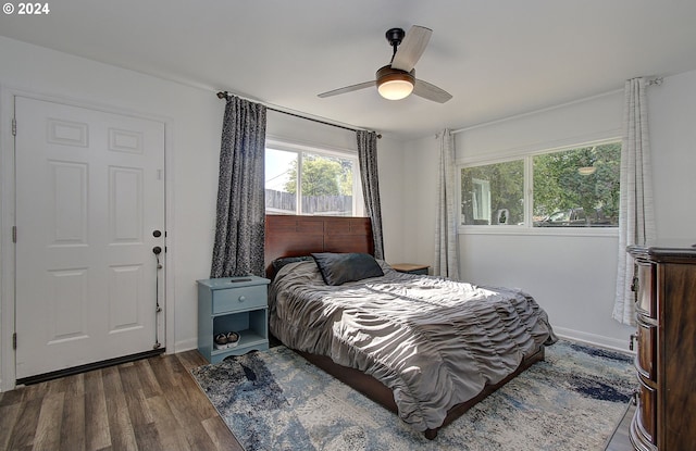 bedroom featuring ceiling fan and dark wood-type flooring