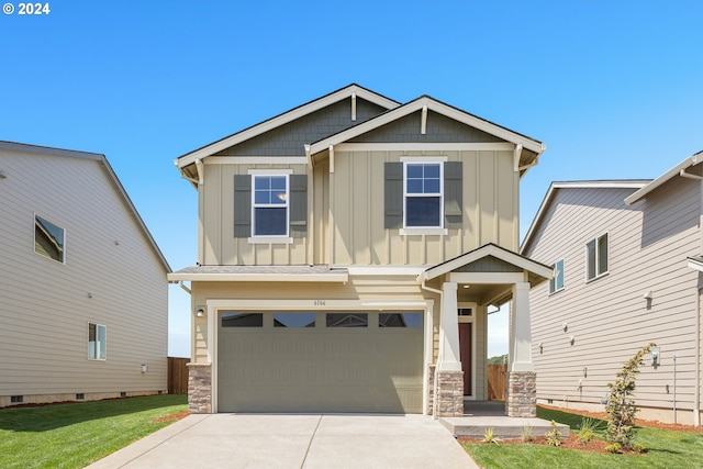 craftsman inspired home with a front lawn and a garage