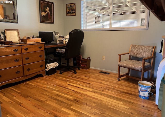 office space with light hardwood / wood-style floors