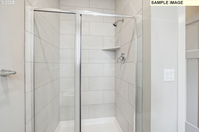 full bathroom featuring a shower stall