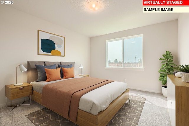 bedroom featuring baseboards and carpet flooring