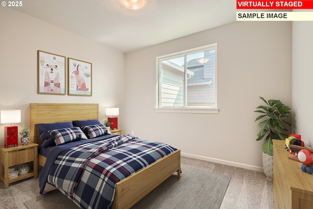 bedroom featuring carpet and baseboards