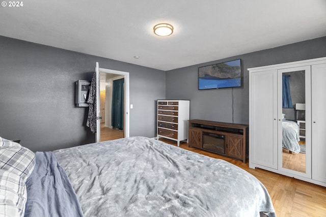 bedroom with wood finished floors