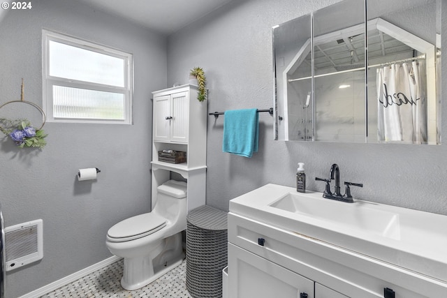 bathroom with vanity, a shower with shower curtain, heating unit, and toilet