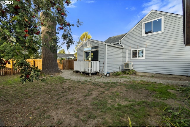 back of house with ac unit