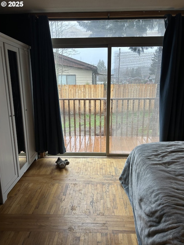 bedroom with wood finished floors