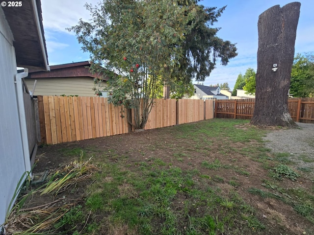 view of yard with a fenced backyard