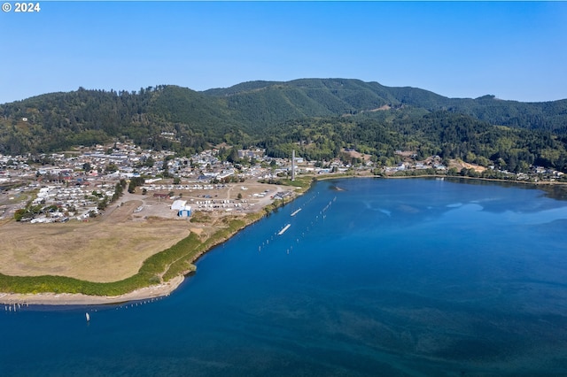 aerial view featuring a water and mountain view