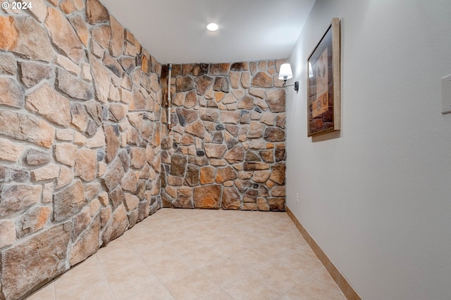 hallway featuring light tile patterned floors