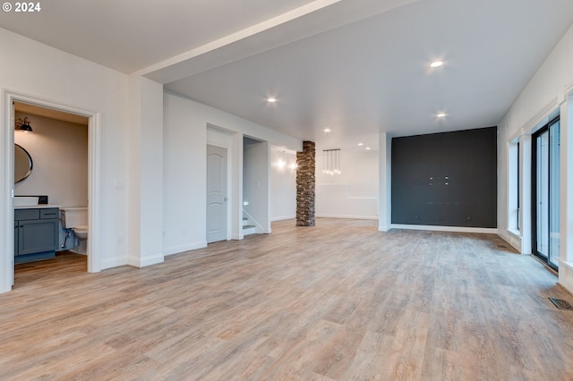 unfurnished living room featuring light hardwood / wood-style floors