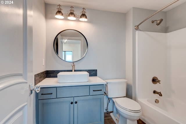 full bathroom featuring vanity, toilet, and  shower combination