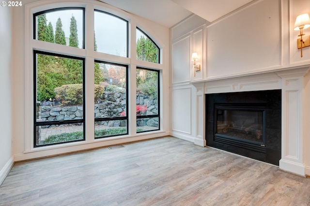 unfurnished living room with light hardwood / wood-style floors