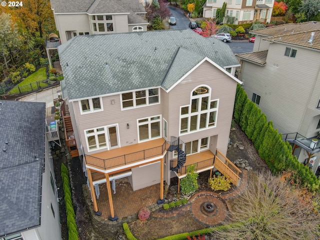 rear view of house with a garage