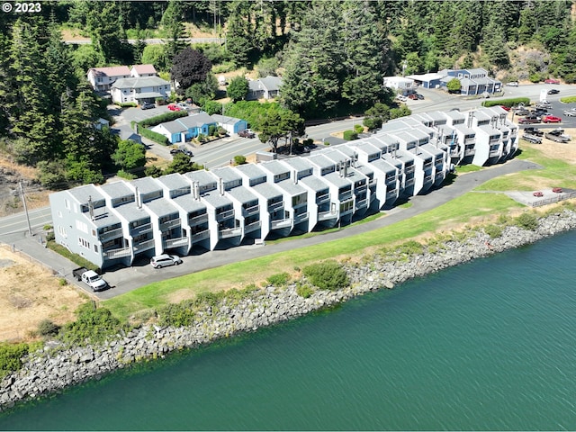 birds eye view of property with a water view