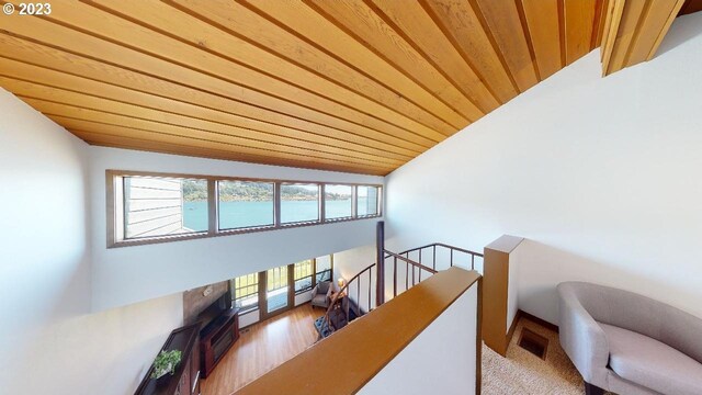 living room with wood ceiling and light hardwood / wood-style floors