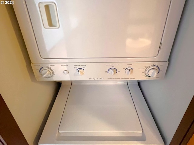 interior space featuring stacked washing maching and dryer and laundry area