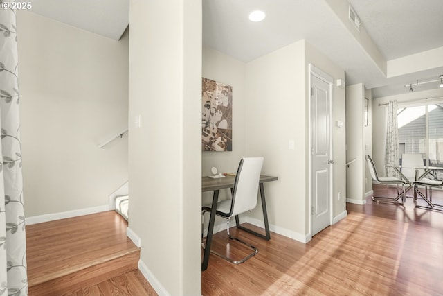 office with light wood-type flooring