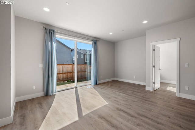 unfurnished room featuring wood-type flooring