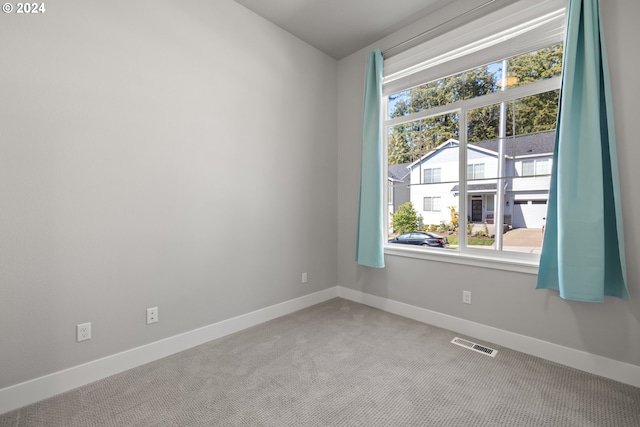 unfurnished room with carpet flooring