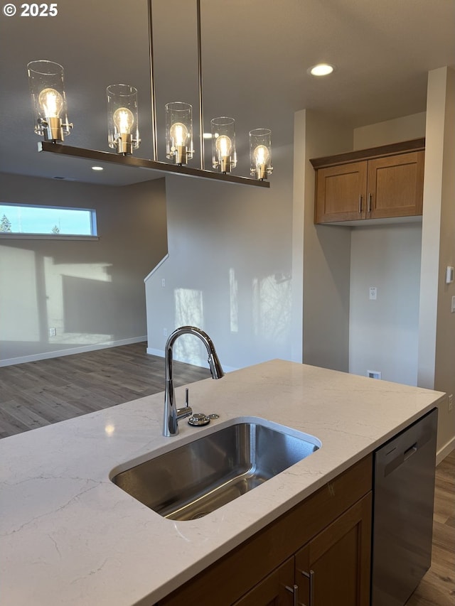 347 SE Shetterly Dr, Dallas, OR 97338 - kitchen featuring dishwasher, light stone counters, pendant lighting, dark hardwood / wood-style flooring, and sink
