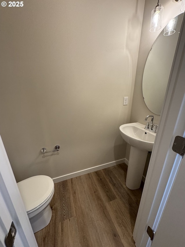 347 SE Shetterly Dr, Dallas, OR 97338 - bathroom with toilet, sink, and wood-type flooring