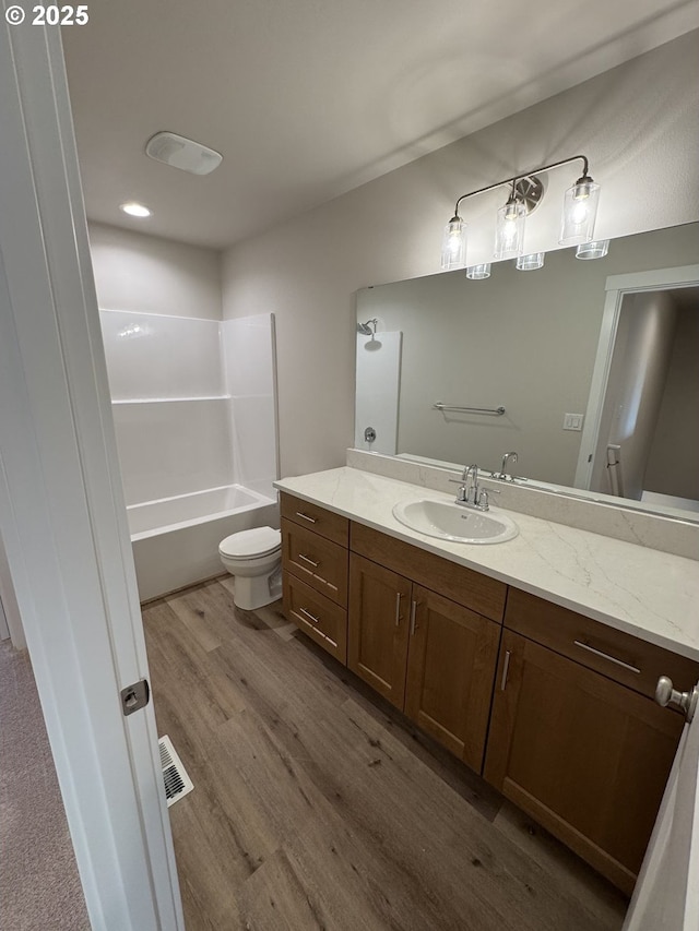 347 SE Shetterly Dr, Dallas, OR 97338 - full bathroom featuring toilet, shower / bathtub combination, vanity, and wood-type flooring