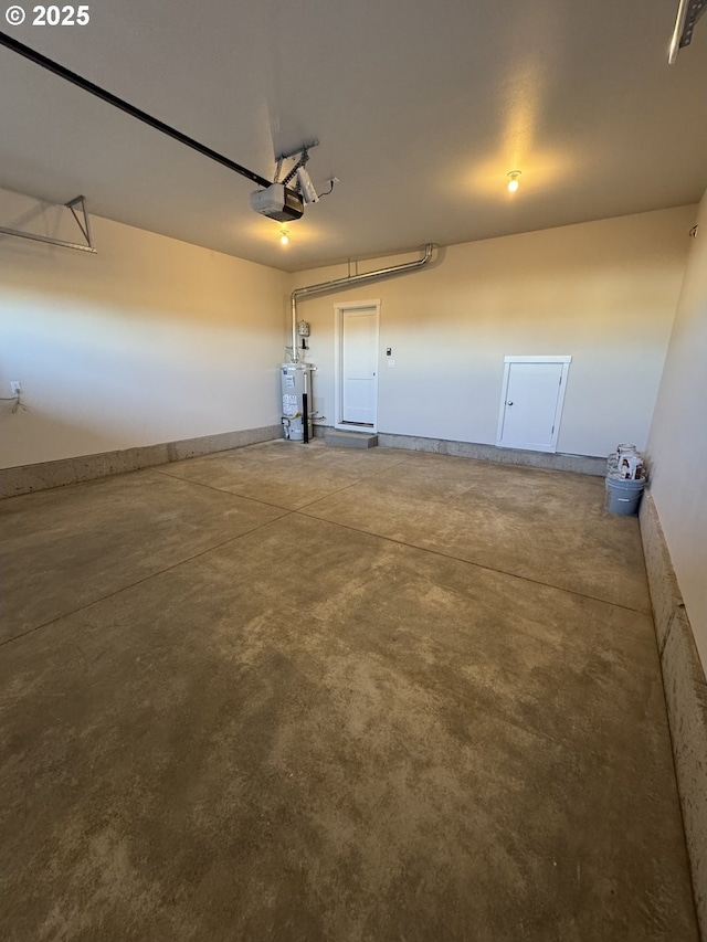 347 SE Shetterly Dr, Dallas, OR 97338 - garage featuring a garage door opener and gas water heater