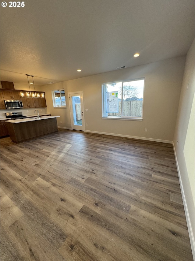 347 SE Shetterly Dr, Dallas, OR 97338 - interior space with plenty of natural light, sink, and hardwood / wood-style floors