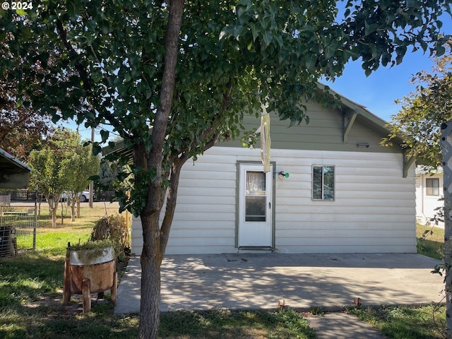 back of property featuring a patio