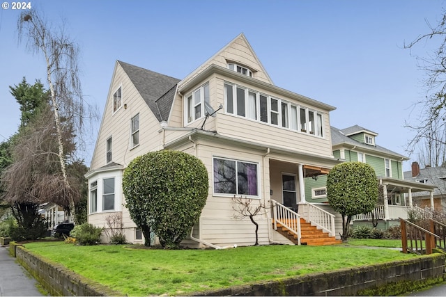 view of front of property with a front lawn and a porch