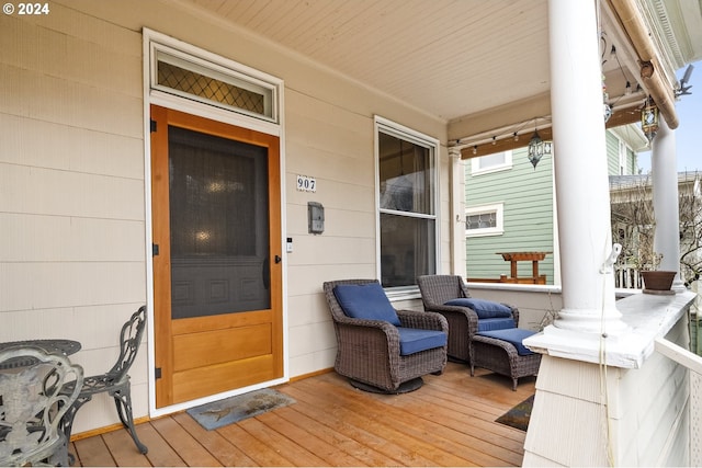 view of exterior entry with covered porch