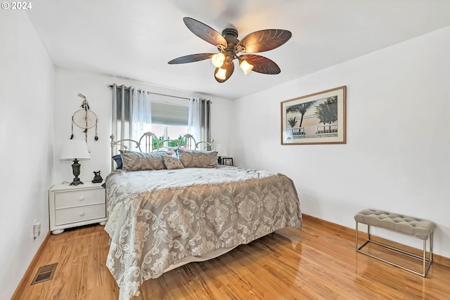 bedroom featuring ceiling fan and light hardwood / wood-style flooring