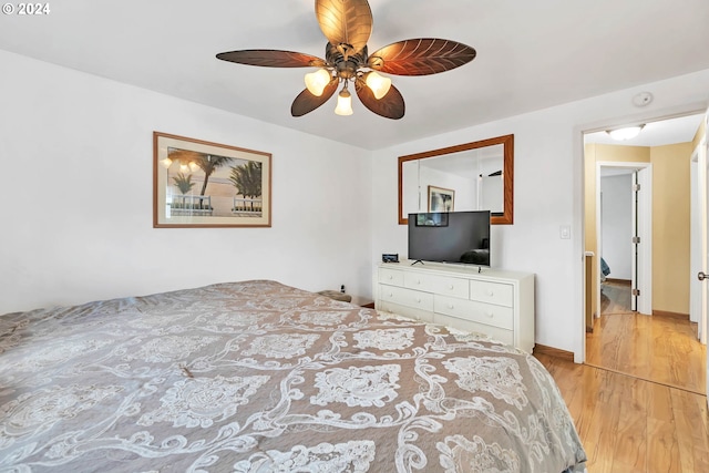 bedroom featuring ceiling fan and light hardwood / wood-style flooring