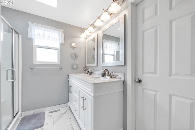 bathroom with tile patterned flooring, a shower with door, and vanity