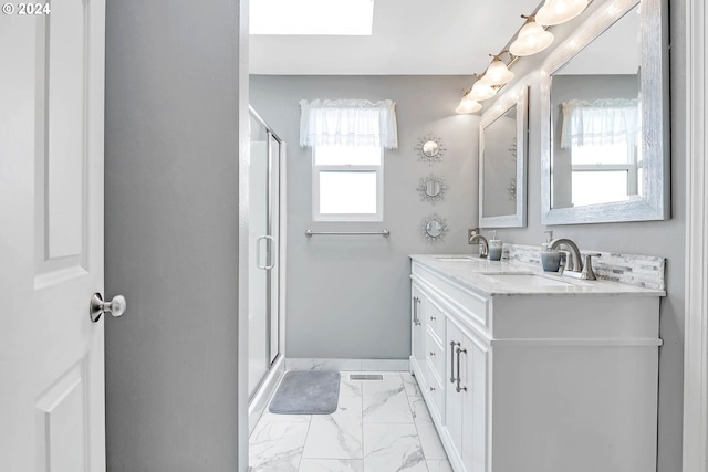 bathroom with tile patterned flooring, vanity, and a shower with shower door