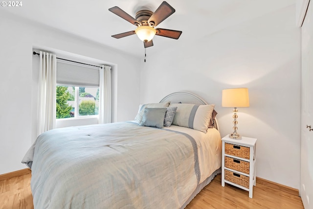 bedroom featuring ceiling fan and light hardwood / wood-style flooring