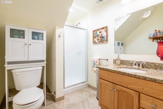 bathroom with a shower with shower door, tile patterned floors, vaulted ceiling, vanity, and toilet