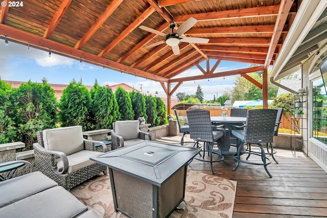 wooden deck with ceiling fan, an outdoor living space with a fire pit, and a gazebo