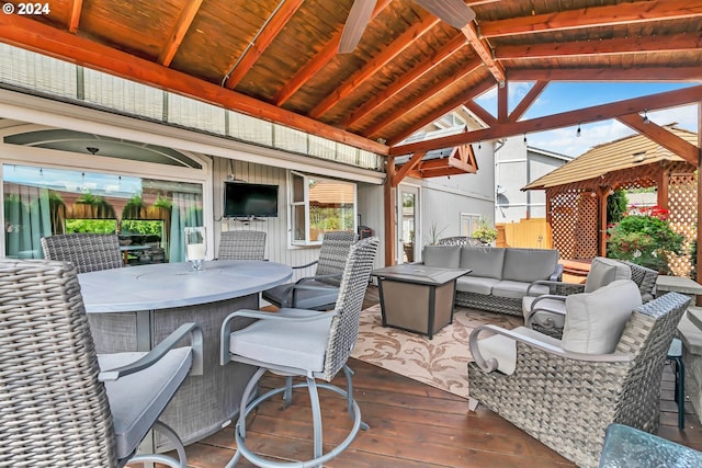 wooden terrace featuring an outdoor hangout area