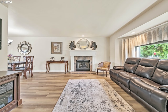 living room with a fireplace and light hardwood / wood-style floors