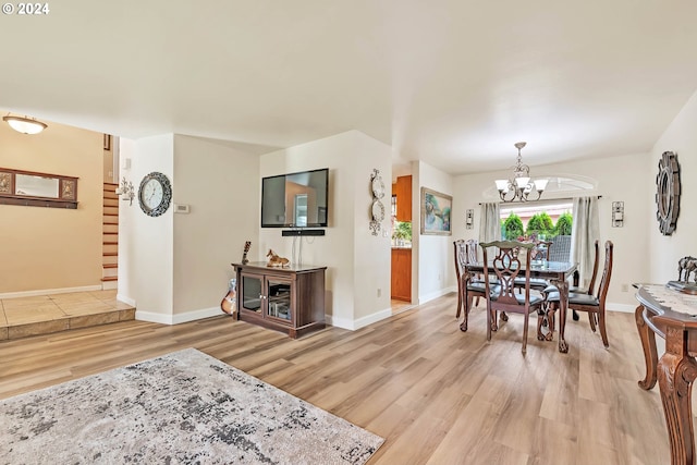 interior space featuring wood-type flooring and a notable chandelier