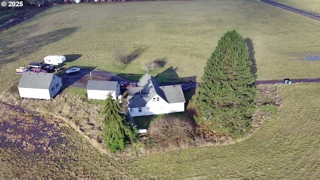 birds eye view of property with a rural view