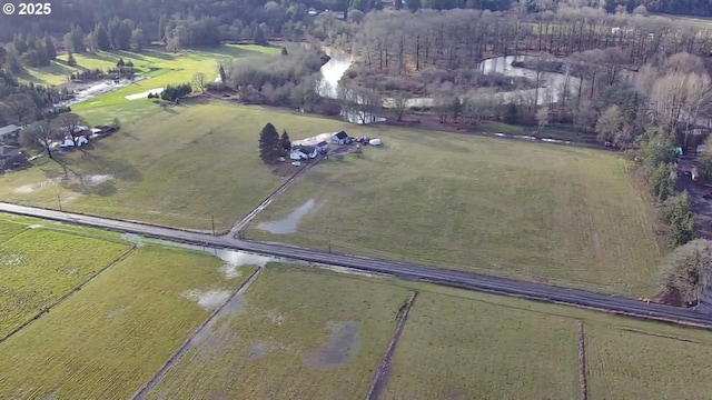 birds eye view of property with a rural view